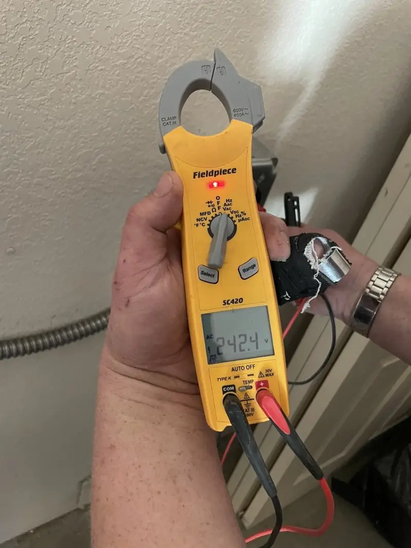 Voltage testing with clamp meter during Generator Installation in Watford City